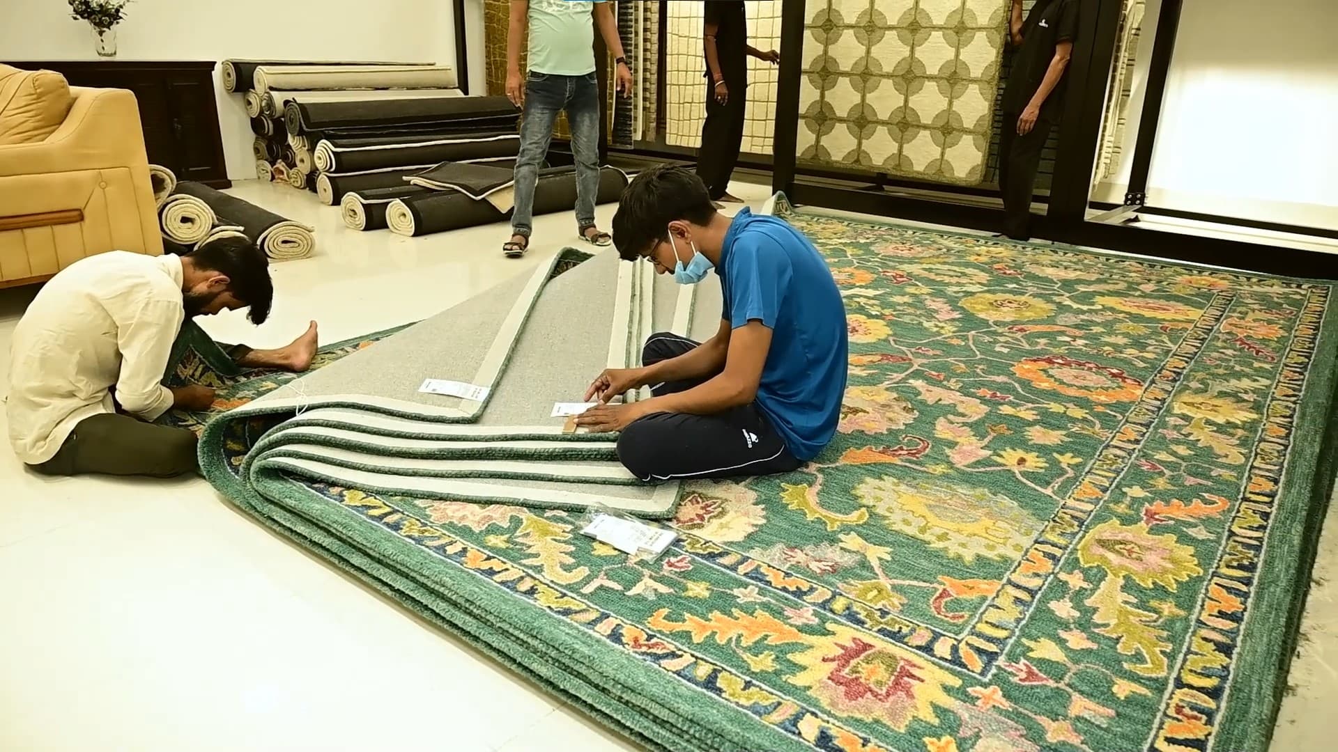 Detailed carpet weaving process showing intricate patterns